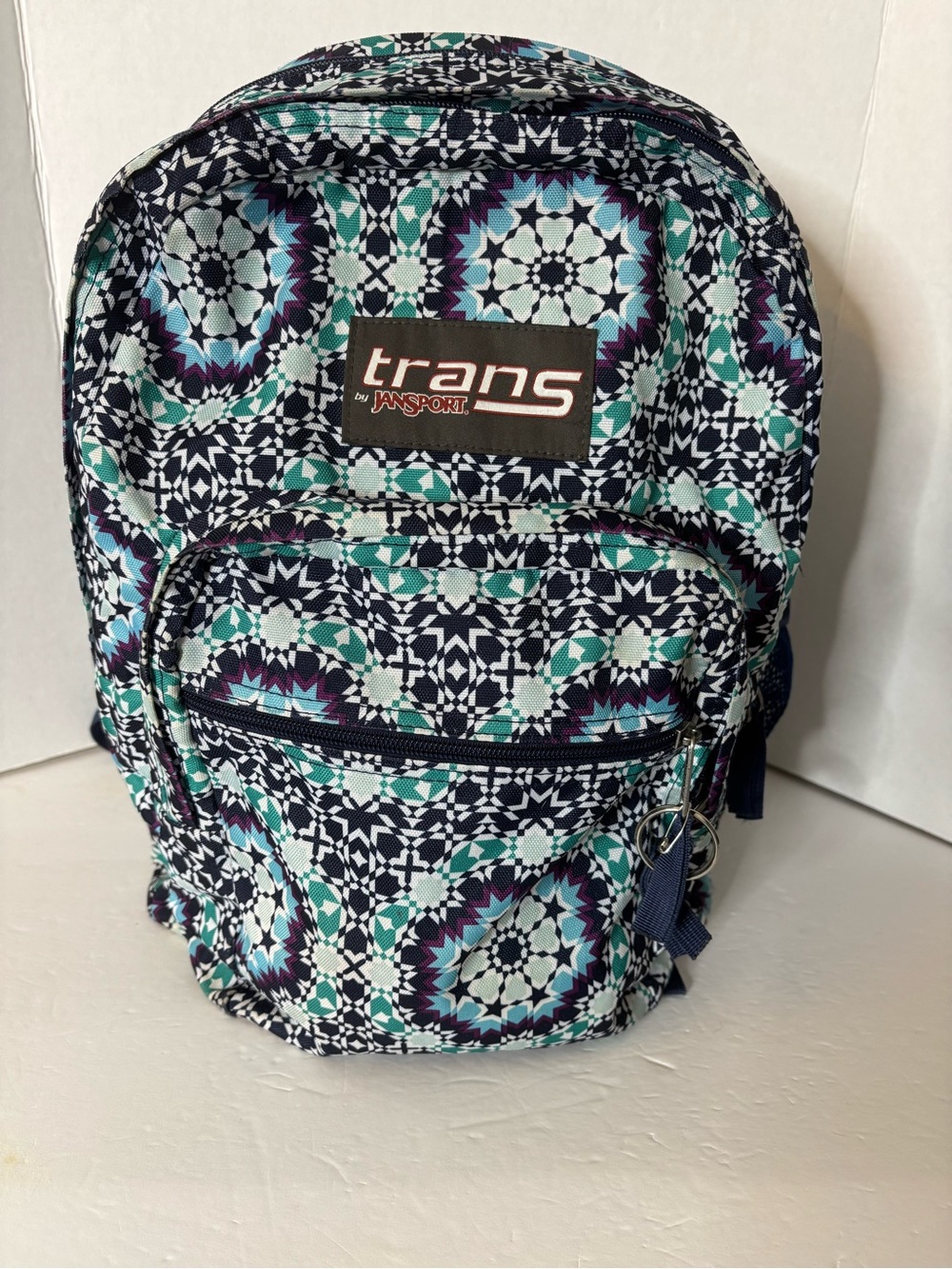 Trans by.
JanSport Supermax "Navy Moonshine Moroccan" pattern backpack